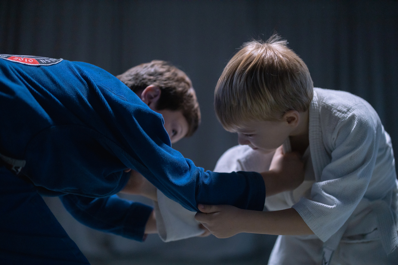 Boy in White T-shirt and Blue Jacket